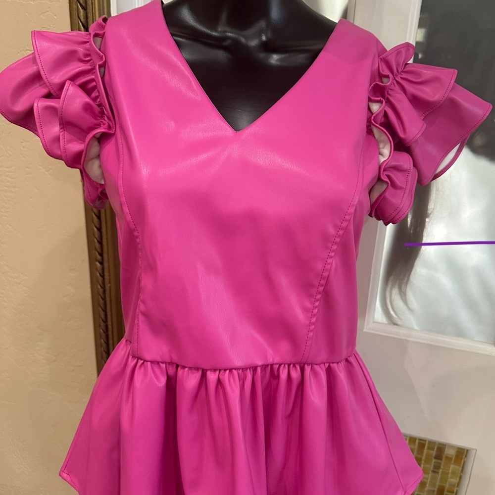 Hot, pink pleather  flutter sleeve top.
